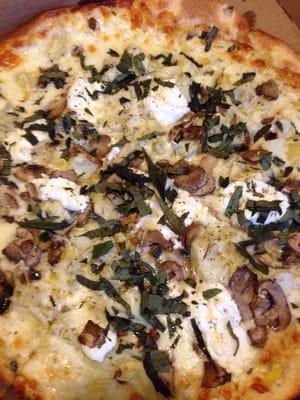 Large Full Moon pizza tricked up with artichokes, mushrooms and fresh basil. Very, very good.