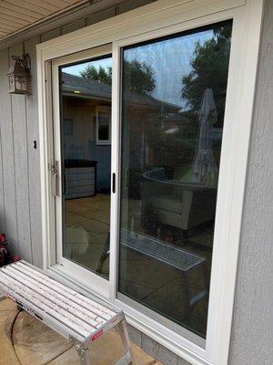 Sliding patio door with screen