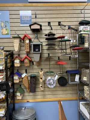 A wall of bark butter, suet and cylinder feeder products