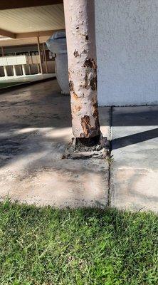 Pole at clubhouse mailboxes rusting away from years of neglect.