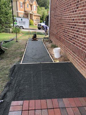 Grading a sidewalk