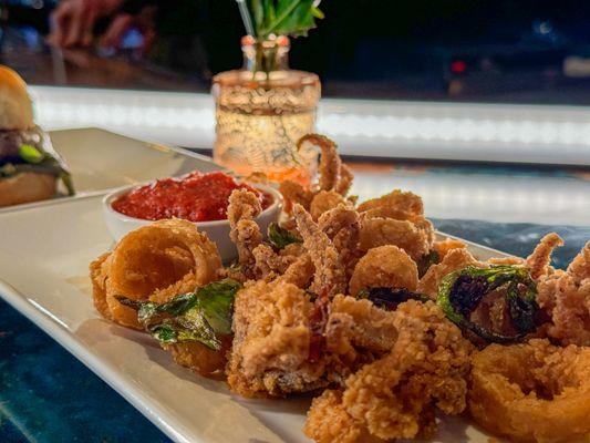 Calamari: Flash fried, shishito pepper, marinara.  Available during Happy Hour and Dinner.