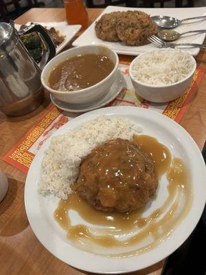 The egg foo young patties along with your rice and a bowl of sauce.