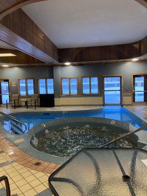 Indoor jacuzzi and inside/outside pool