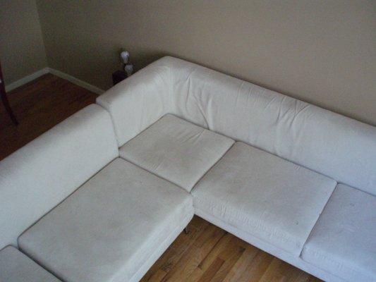 Sofa sectional white before cleaning.