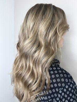 Baby lights lowlights 
Long layers 
Styled with curling iron.