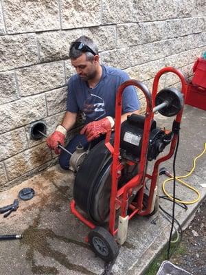 Clearing a drain in Kalihi