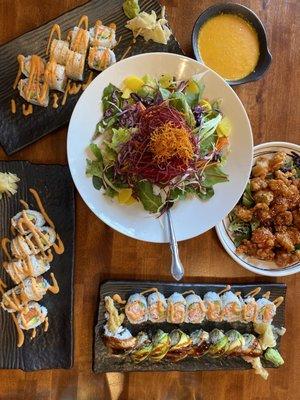 Popcorn Chicken, mixed greens, Spicy Salmon and Avocado Roll, Spicy California Roll, Dragon Roll