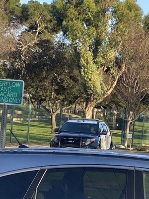 Cops being paid to sit in the park on their phone. Our tax dollars at work. This ain't good. Sad