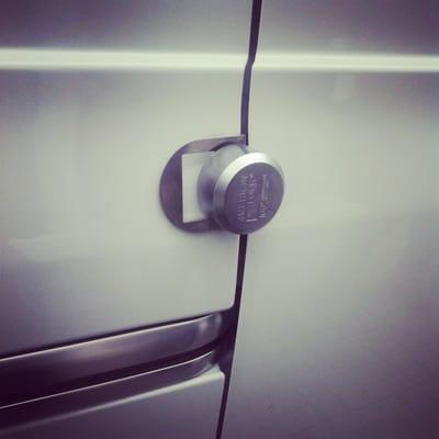 Slick lock installed on side door of a Nissan NV van