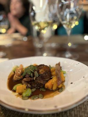 Guinea Hen Confit with Lima Beans, Pumpkin, Cipollini Onions, and Pumpkin Seed Pesto