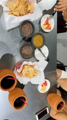 Chips with salsa and beans. Agua fresca de jamaica