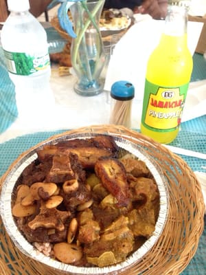 Oxtail, sweet plantains, curry goat, rice and peas, vegetables