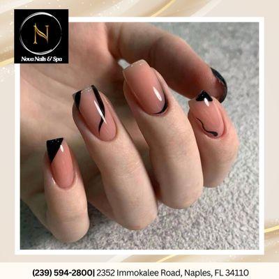 Flaunt your style with nude square nails adorned with a simple black design--pure sophistication!