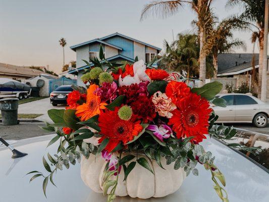 Flower arrangement with a real pumpkin base