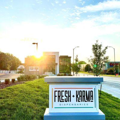 in front of Fresh Karma