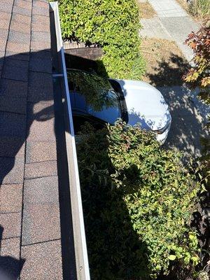 After: Gutter cleaning success! Your roof and gutters are now spotless and functional.