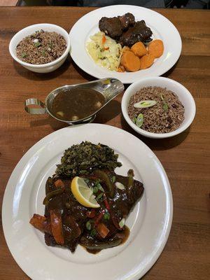 Jerk Chicken & Salmon, Rice n peas, Cabbage. Sweet Potatoes, Callaloo & Oxtail Gravy.