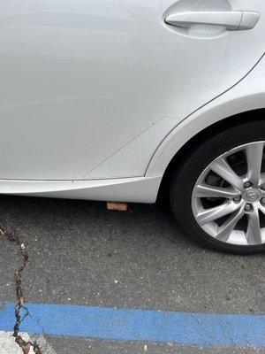 Wood plank left underneath my car by technician .. seriously???!