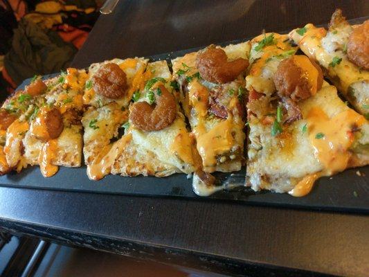 Shrimp po boy flatbread.  thick crust - if you're into that. Shrimp and chipotle sauce are nice and flavorful.