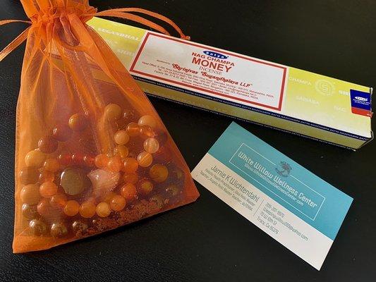 MONEY Incense , bracelet and crystals i had bought ( the orange bag was giving when i purchased the crystals , SCORE !) And business card.