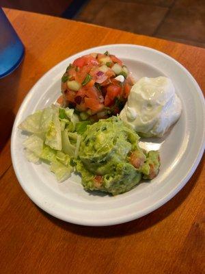 Fresh guac, pico, salsa and sour-cream accompany the entree :)