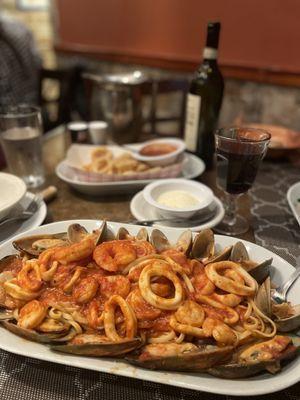 Ocean pasta with marinara (calamari in the background)