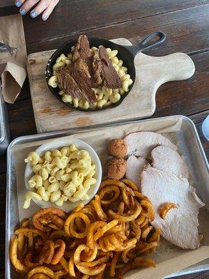 Smoked Turkey with Mac and cheese and curly fries. Brisket Mac and cheese