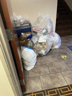 Is this a stairwell or a dumpster?  I don't know.  But I suspect this MIGHT be why the hallway smells like a food court dumpster.