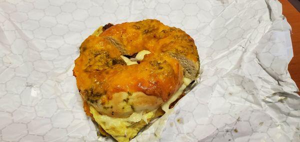 Bacon, egg, and cheese on a jalapeno cheddar bagel.