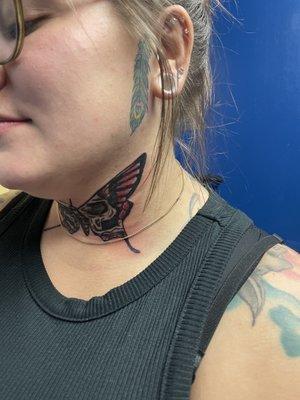 Butterfly neck tattoo by Eric Delshun.This tattoo was did at Indigo Tattoos shop in Memphis Tn