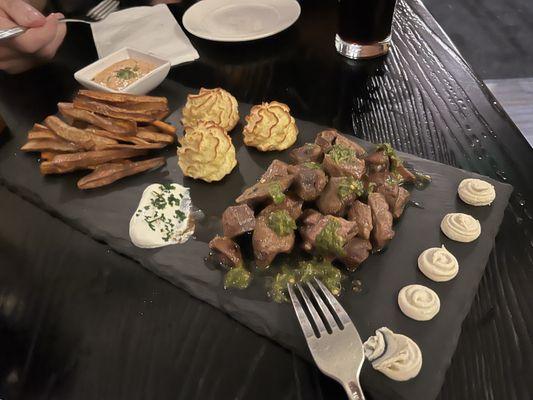 Steak bites, potato puffs and yucca fries.