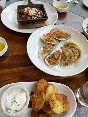 Appetizers of saganaki (top), oysters Onassis (middle) and Ikari-style fried zucchini (bottom)