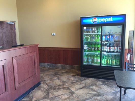 Bare bones store with drinks in cooler for take out and restrooms for customers' convenience.