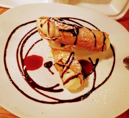 Chocolate cannoli with raspberry sauce