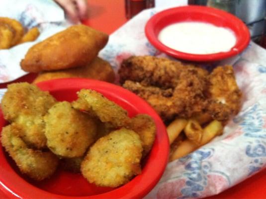 Chicken fingers and fried pickles with gravy.