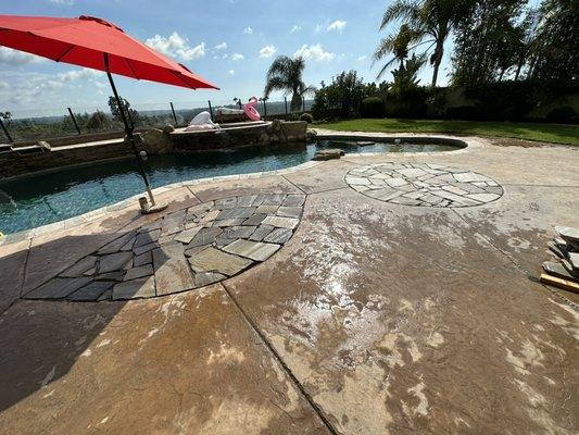 Removed island designs, and replaced with flagstone and concrete to match existing concrete.