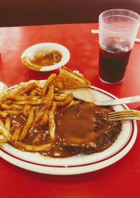 chop steak with french fries gravy on the whole shebang. toast & a diet Pepsi