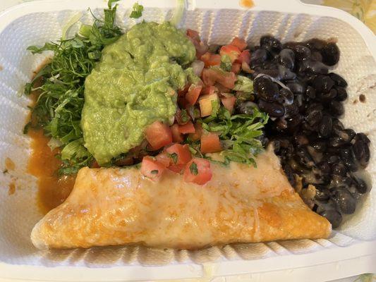 Carnitas enchilada ala carte $9 with Blk beans, salsa, greens  and guacamole.  It's filling but not so tasty.