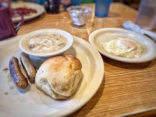 Biscuit and Gravy with sausage and one egg. This is a half.