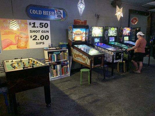 There are a few classic pinball machines, a football table and a shelf of various board and card games for you to enjoy.