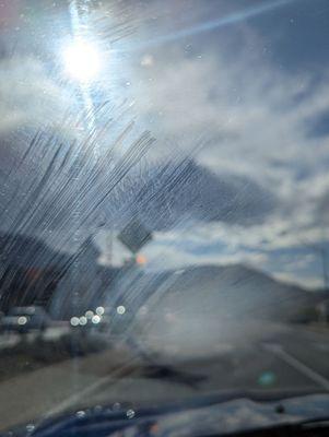 Windshield *after* they "cleaned" it.