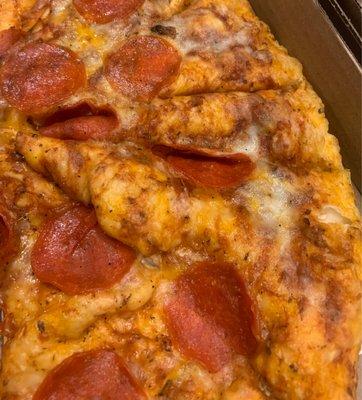 Pepperoni pizza with extra sauce.