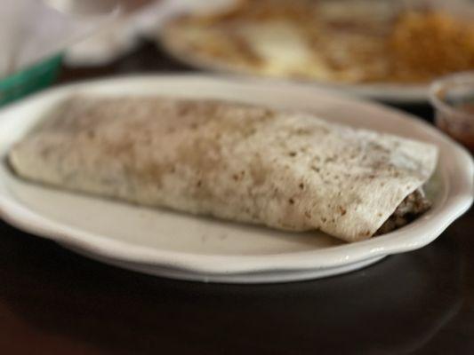 Carne Asada burrito. It doesn't look big in the picture, but I was only able to eat half of the burrito and that's very rare.