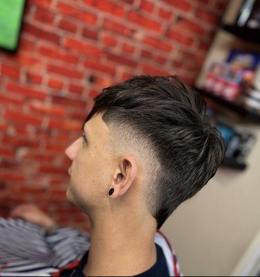 Mohawk fade with messy top