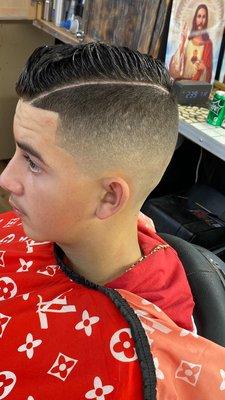 Bald low fade with hard part comb over