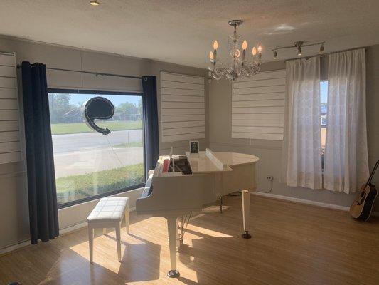 Front piano room with a beautiful chandelier!