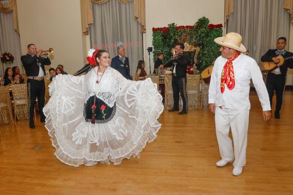 Mariachi and Folklore Dancers during ceremony at ballroom.