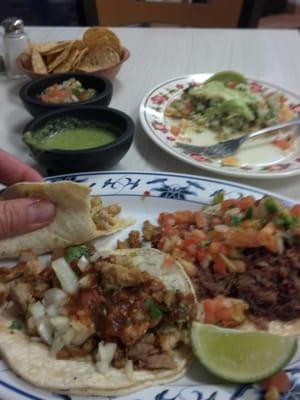 Two chicken tacos, a carnitas taco, fresh ceviche, chips, and salsa.