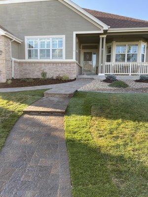 New paver walkway and steps leading to front door. In Aurora CO